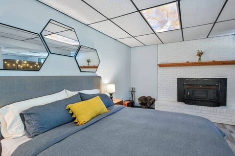 Snuggle up in a luxurious king size bed in front of the fireplace.