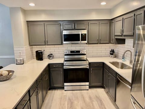 Gorgeous kitchen stocked with everything you would need for cooking in your lake and mountain getaway. Everything is brand new: stainless appliances, custom quartz countertops, kitchen cabinets, etc.