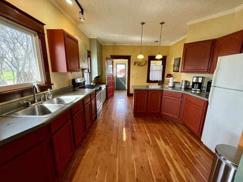 Spacious kitchen is fully equipped and ready to use. 