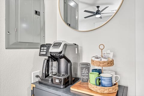 Duo coffee pot for K-cup or whole pot, with starter coffee and creamer.