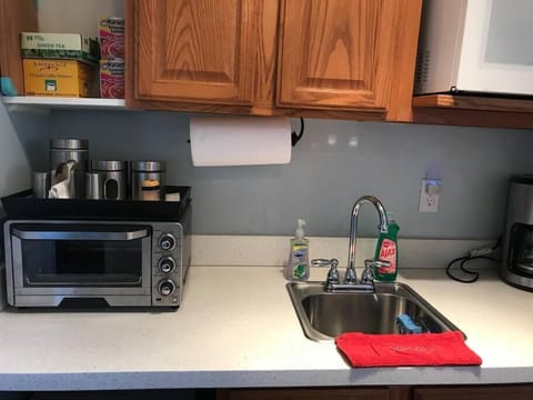 Fridge, microwave, coffee/tea maker, cookware/dishes/utensils