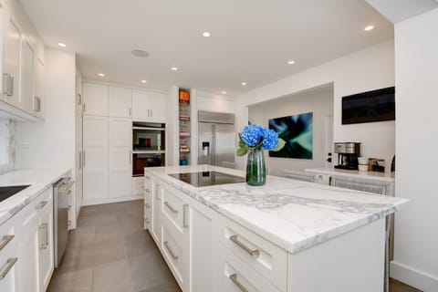 Fully equipped chef's kitchen, coffee station, wine fridge