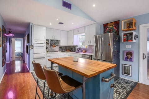 Custom furniture throughout house including this beautiful Teak Wood island. Dog door goes into backyard for small to med size dogs. No dogs larger than 60lbs please. Are you a Belieber?