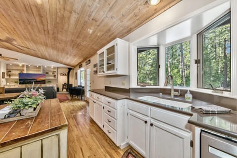 Large kitchen windows looking out to the beautiful backyard.