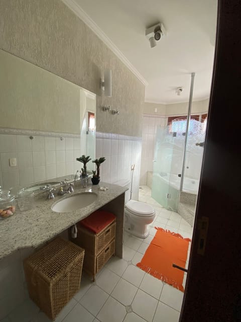 Shower, jetted tub, hair dryer, toilet paper