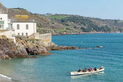 Gig rowers at 3 The Bay, Cawsand, Cornwall