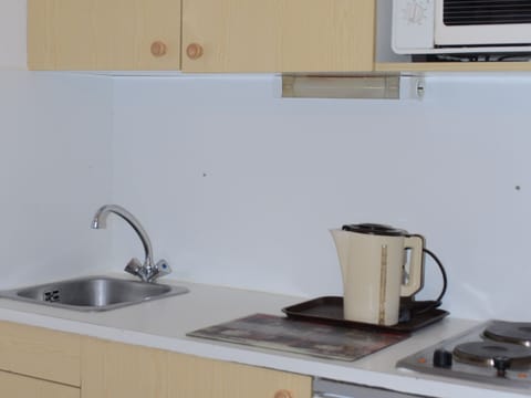 Fridge, microwave, coffee/tea maker, toaster