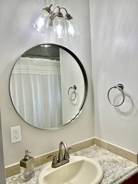 Combined shower/tub, hair dryer, towels, toilet paper