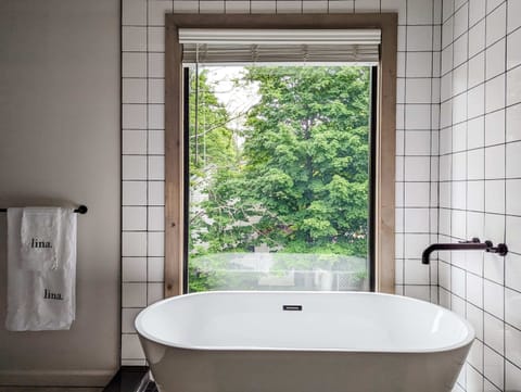 Bathtub, hair dryer, towels