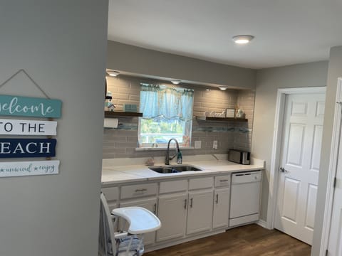 Kitchen with window looking out toward the beach