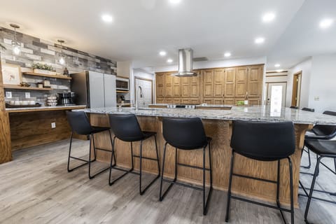 Plenty of bar seating in addition to dining table that seats 6.