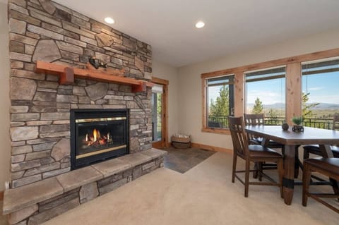 Lower level family room with game table, gas fireplace, and hot tub off of deck!