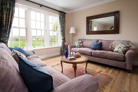 Fairnington East Wing - large triple window in the sitting room with views across rolling countryside