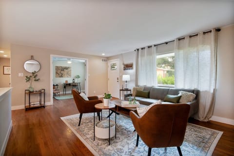 Welcome to our inviting retreat nestled in Arvada, CO! Relax and unwind in the cozy living room, complete with plenty of seating and a flat screen TV.