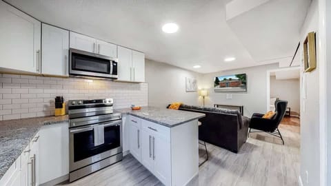 The kitchen is equipped with plenty of counter space, making meal prep and cooking a breeze. It’s an ideal spot for both casual cooking and more elaborate meals, with ample room to spread out and work comfortably.