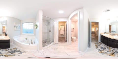 Combined shower/tub, bathrobes, towels, toilet paper