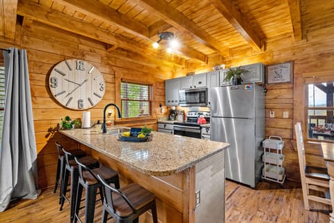 Enjoy a good conversation with family and friends at the kitchen bar area.