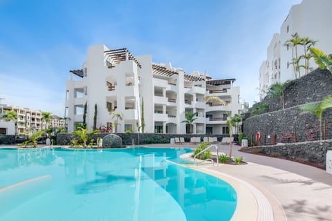 A heated pool, sun loungers