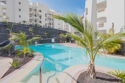 A heated pool, sun loungers