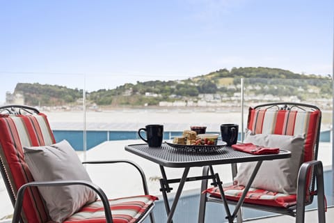 The seating area on the large balcony with river views across the Teign estuary