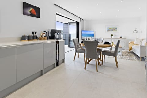The modern open plan living space is the perfect place to cook, dine and relax