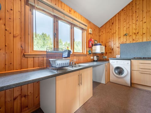 Cabinetry, Countertop, Property, Kitchen, Kitchen Appliance, Wood, Window, Tap, Kitchen Stove, Interior Design