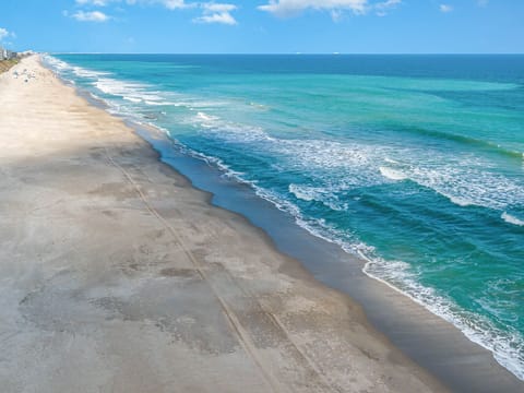 On the beach, sun loungers, beach towels