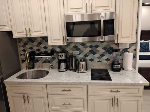 Fridge, microwave, stovetop, coffee/tea maker