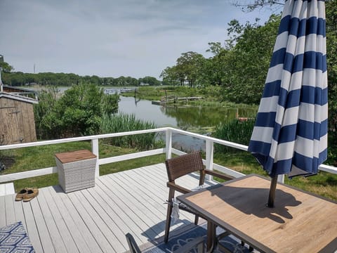 Private deck with seating and gas grill. 