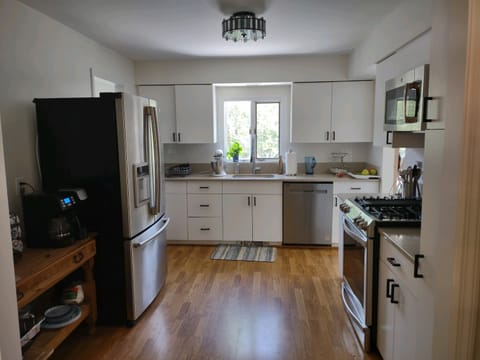 Updated stainless steel appliances in spacious kitchen