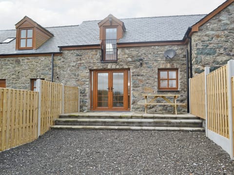 Private exterior courtyard | Ysgubor Myfi - Trehwfa Cottages, Bodedern, near Holyhead
