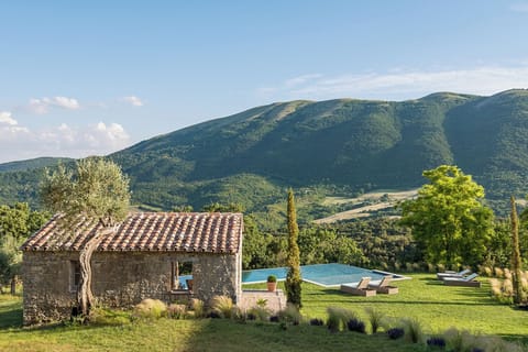 An infinity pool, a heated pool, sun loungers