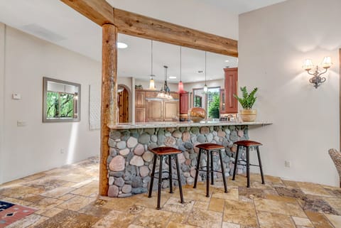 Bar Top Seating for Three into Open Kitchen Area