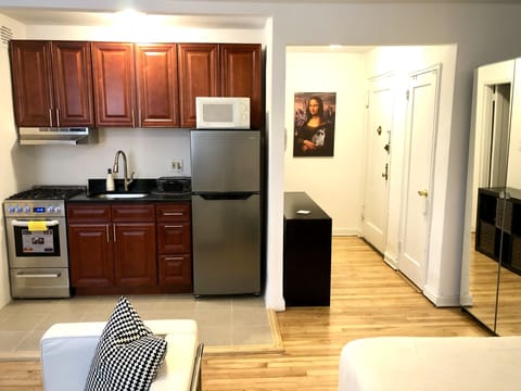 Fridge, microwave, stovetop, dining tables