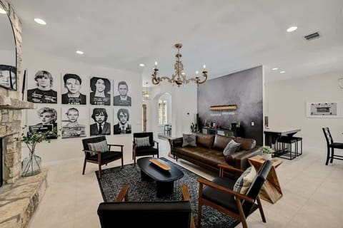 Living Room area with bar, plenty of seating and large smart TV.