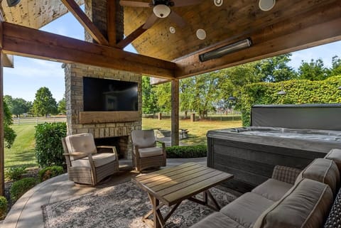 Gorgeous back deck which includes priceless view, comfy furniture, 60 inch tv and hot tub. Great place to relax and unwind. 
