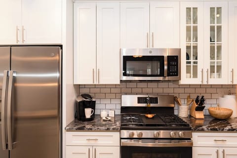 Fully equipped kitchen with all the essentials for cooking and dining during your stay.