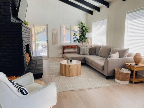 Spacious living room with TV