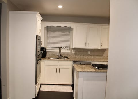 Kitchen with gas cooktop and stainless steel appliances 