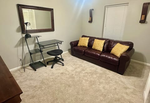 Bonus room with couch and workspace desk