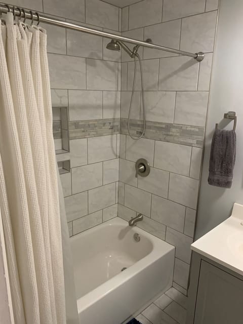 Combined shower/tub, hair dryer, towels, toilet paper