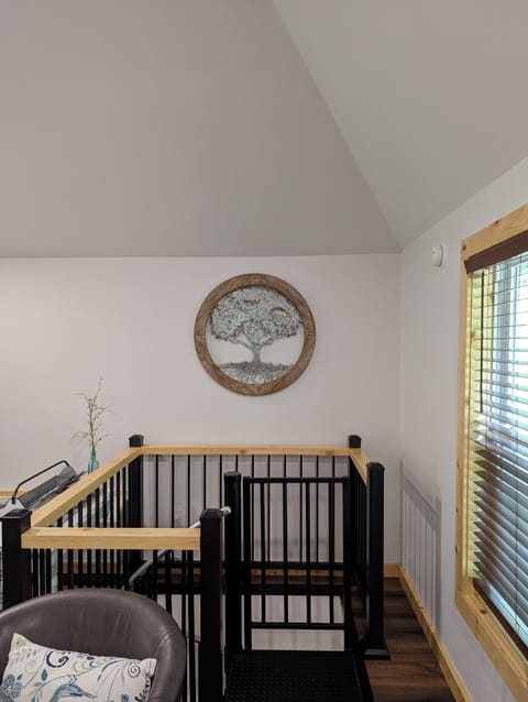 Spiral staircase leading to the lower level.