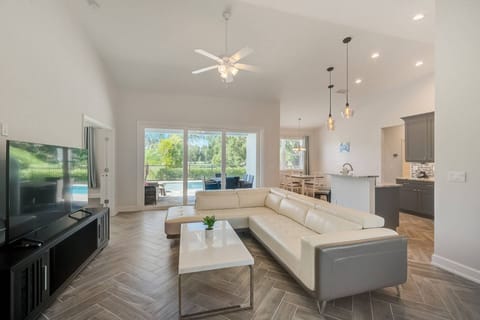 Walk into this gorgeous living room wtih views of the pool and golf course views.