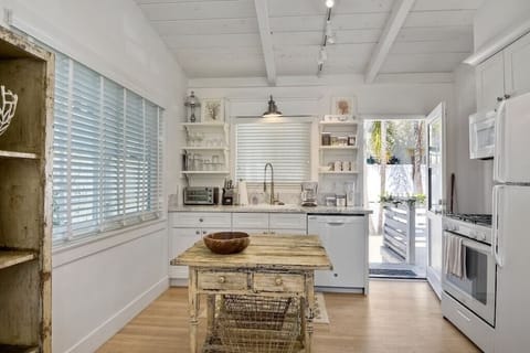 Kitchen view with gas stove/oven.  Dish washer and fridge with ice maker.