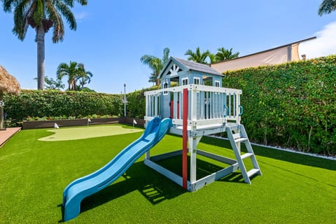 complete with kitchen, balcony, and slide!