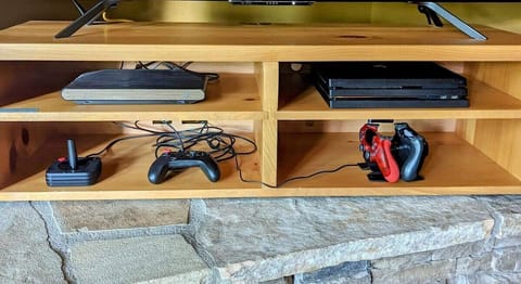 [Living Room] All generations can connect here over a retro gaming console (Atari VCS) or on a Play Station 4 Pro.