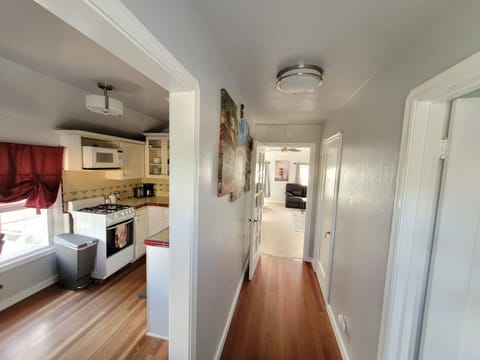 Kitchen on left, bathroom on right, and a large walk-in closet