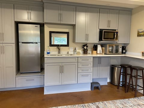 Fridge, microwave, stovetop, coffee/tea maker