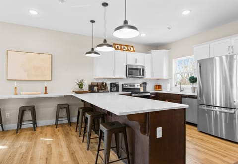 The open dining area flows seamlessly into the kitchen, making it easy to entertain and enjoy meals together.