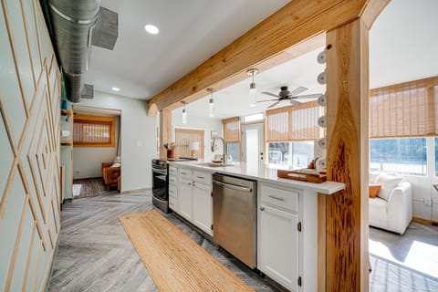 Kitchen is fully equipped with an electric stove with an oven, refrigerator, microwave, and a Keurig